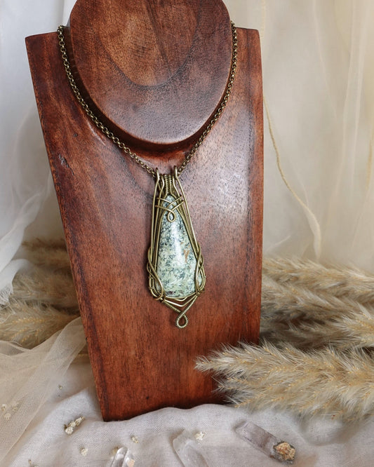 Mexican turquoise wirewrap pendant showing rare blue-green stone