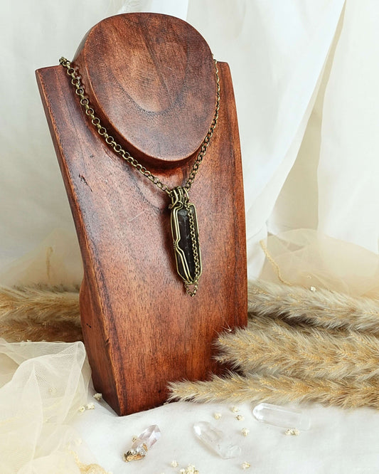 Black quartz pendulum pendant showing dark crystal point