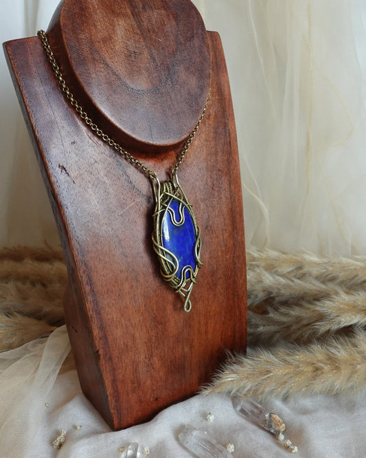 Lapis lazuli wirewrap pendant showing deep blue stone with golden pyrite