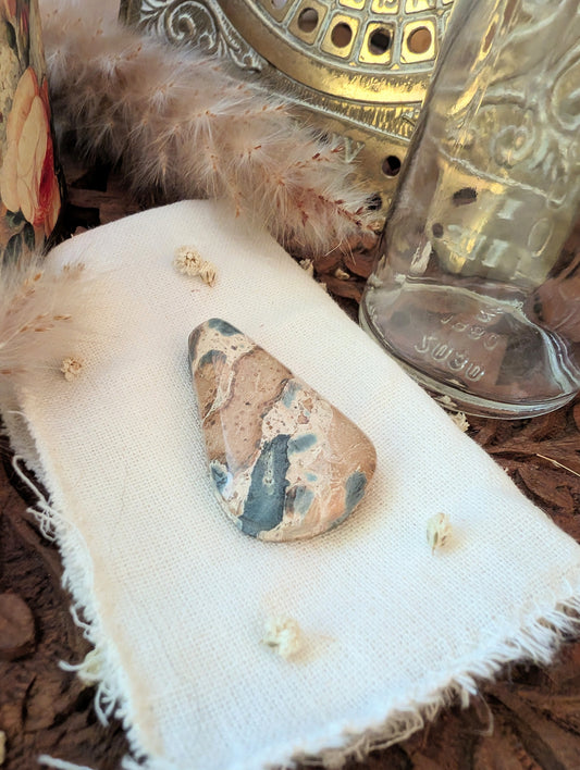 Leopardite jasper stone — side angle showing natural pattern