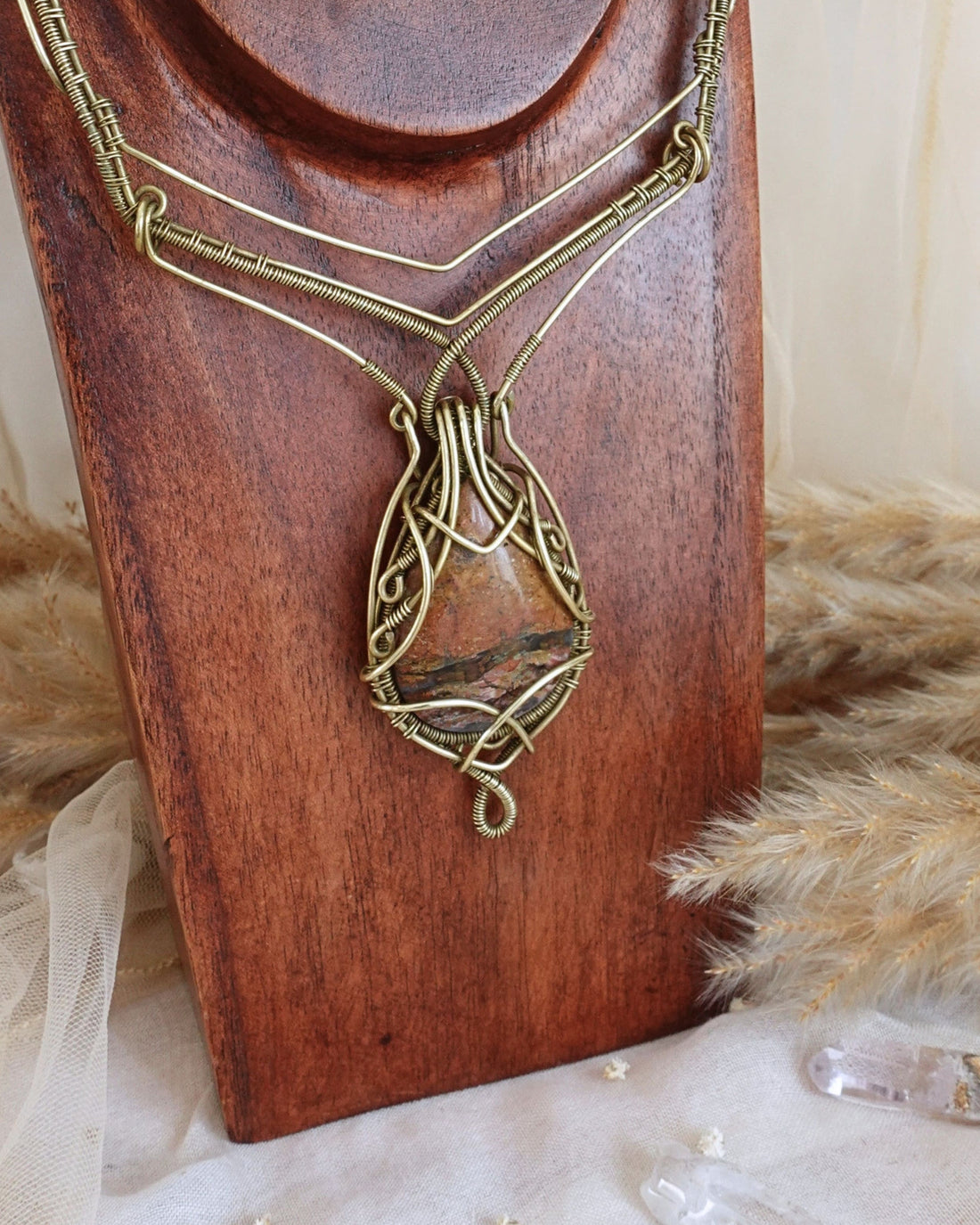 Ocean jasper wirewrap necklace showing earthy multi-tone stone, the joyful stone of natural rhythm