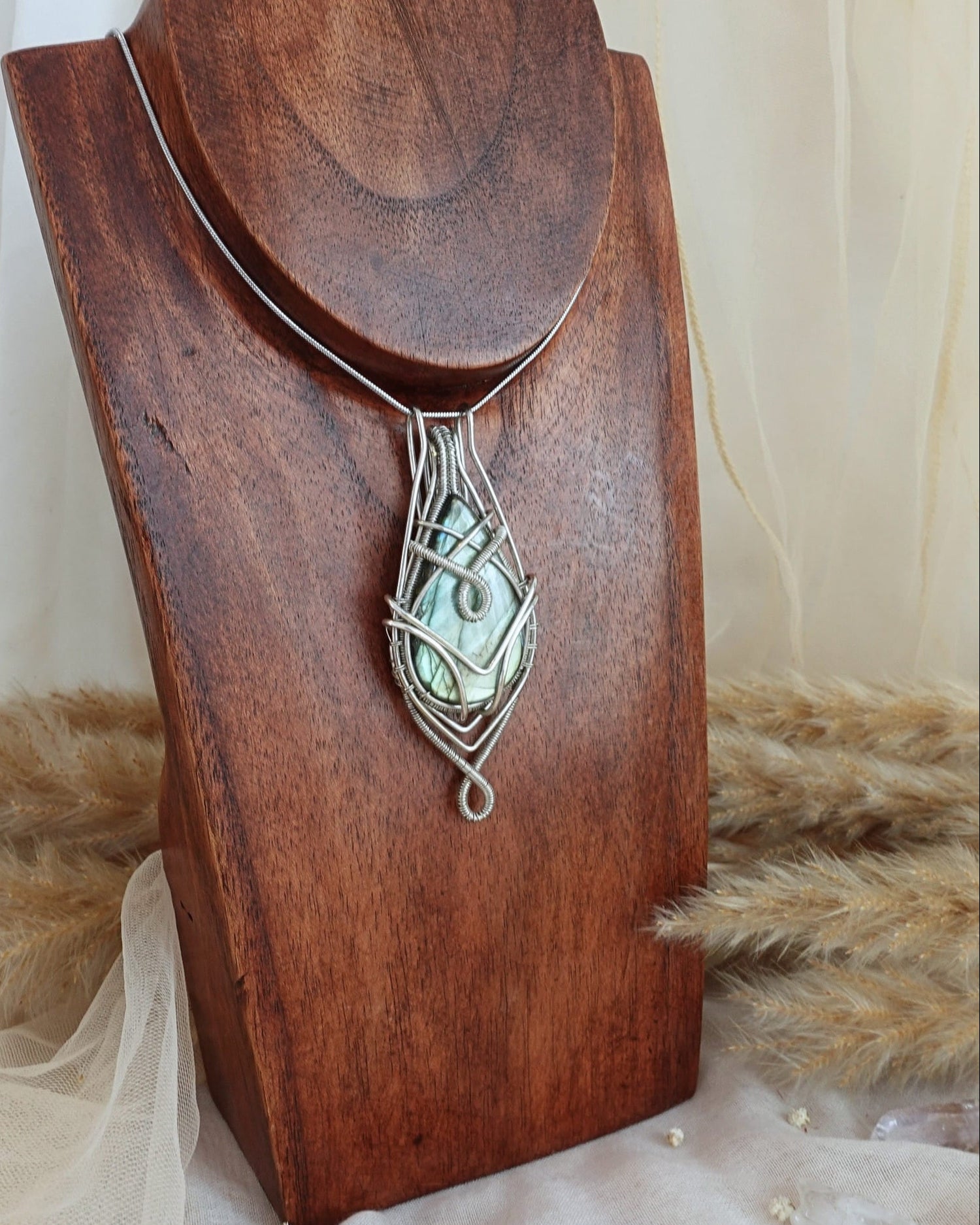 Handmade labradorite necklace with silver-plated alpaca wirewrap pendant — front view
