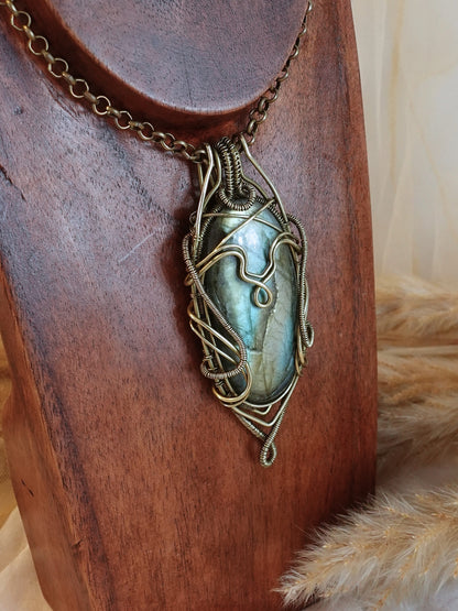 Side view of bold labradorite wirewrap pendant on brass chain