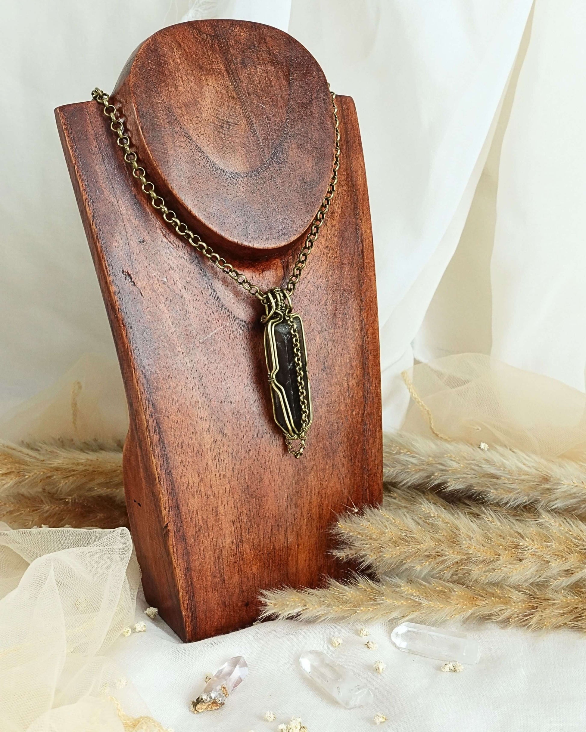 Black quartz pendulum pendant showing dark crystal point