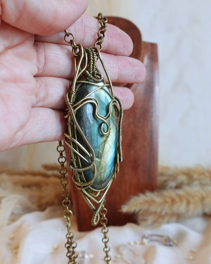 Detail of brass wirework holding the bold labradorite gemstone