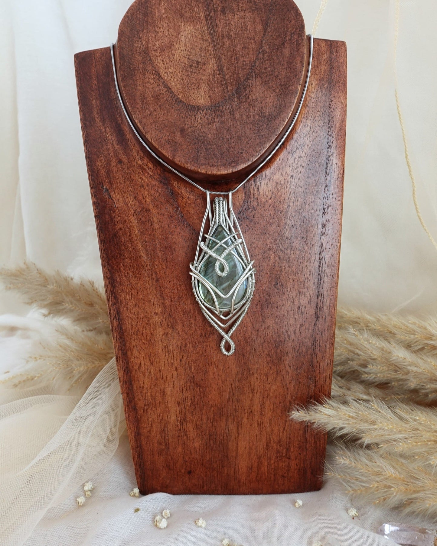 Silver-plated labradorite wirewrap pendant showing iridescent flash