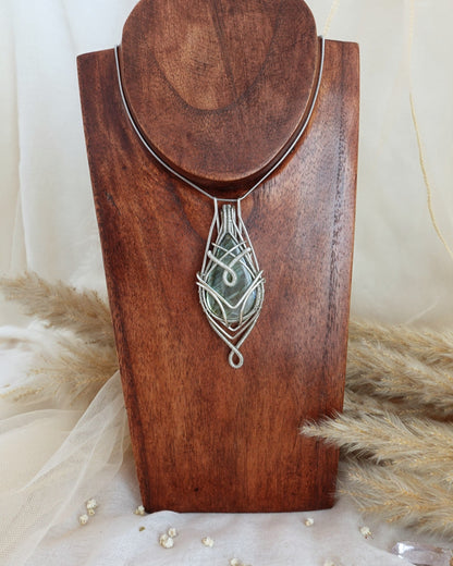 Silver-plated labradorite wirewrap pendant showing iridescent flash