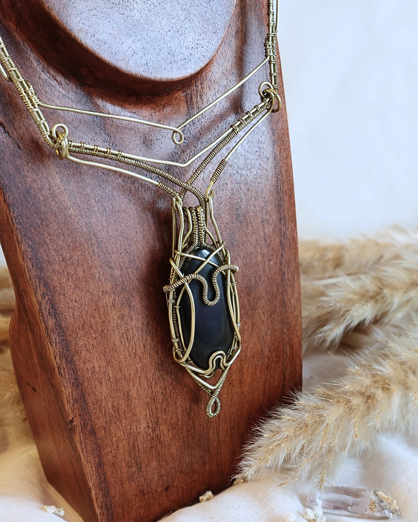 Handmade Black Onyx VÏ necklace with intricate brass wirewrap pendant — front view