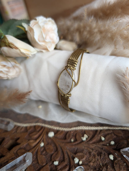 Detail of brass wirework holding the citrine stone