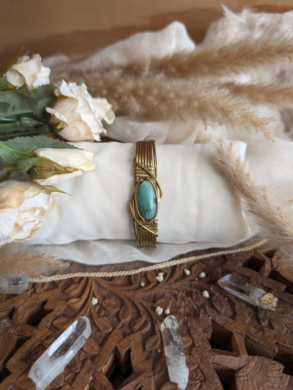 Side view of chrysocolla bracelet in adjustable brass wire