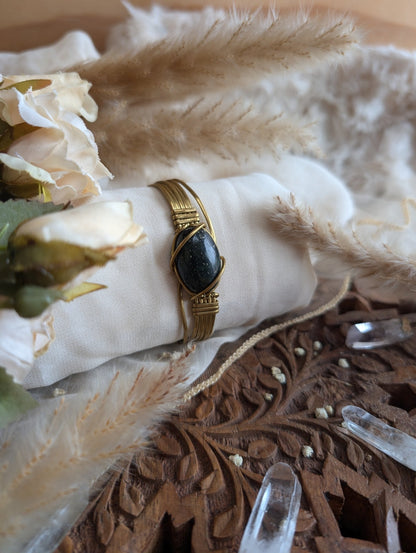 Handmade dark jade bracelet on brass wire — front view
