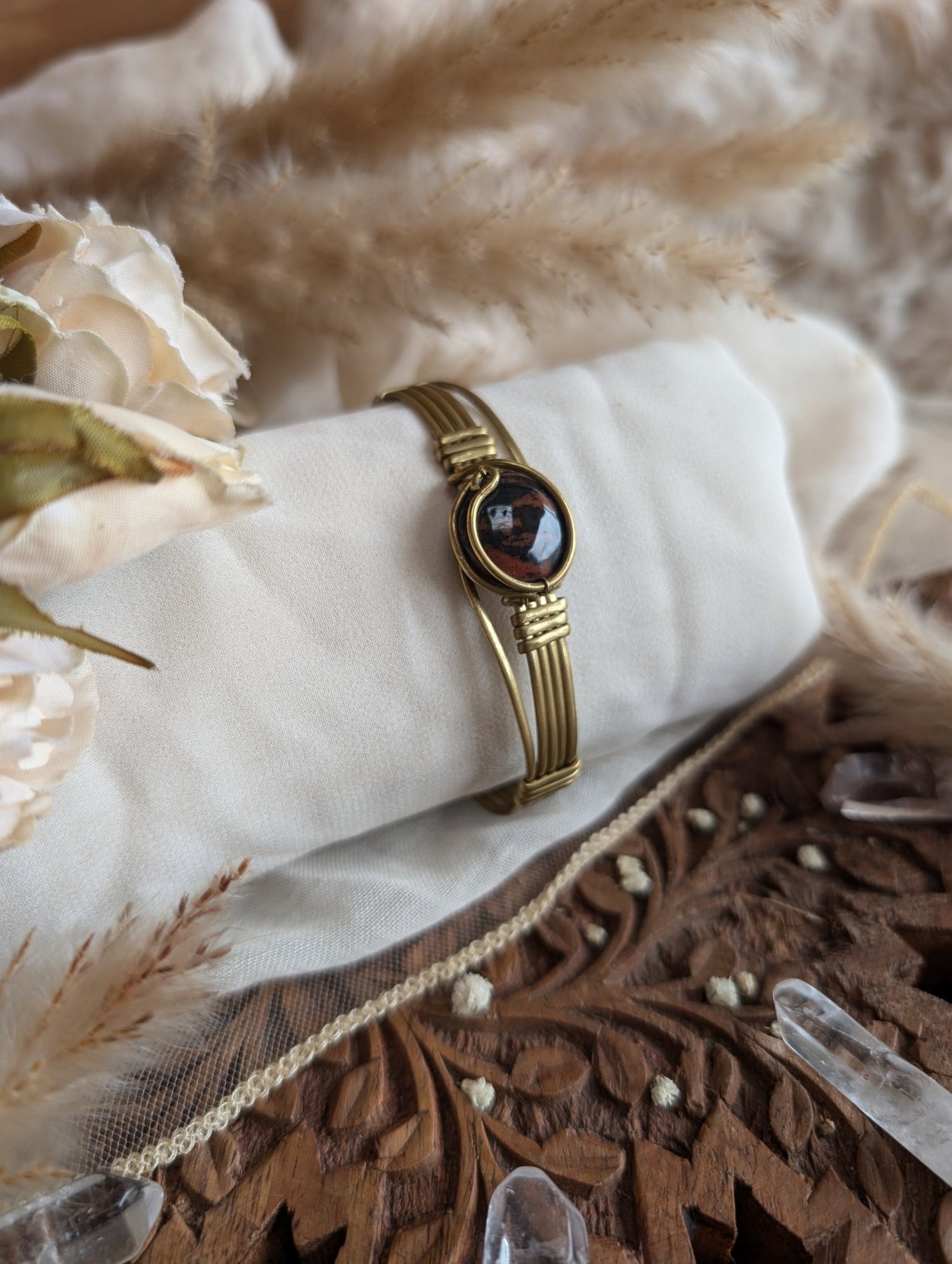 Handmade mahogany obsidian bracelet on brass wire — front view