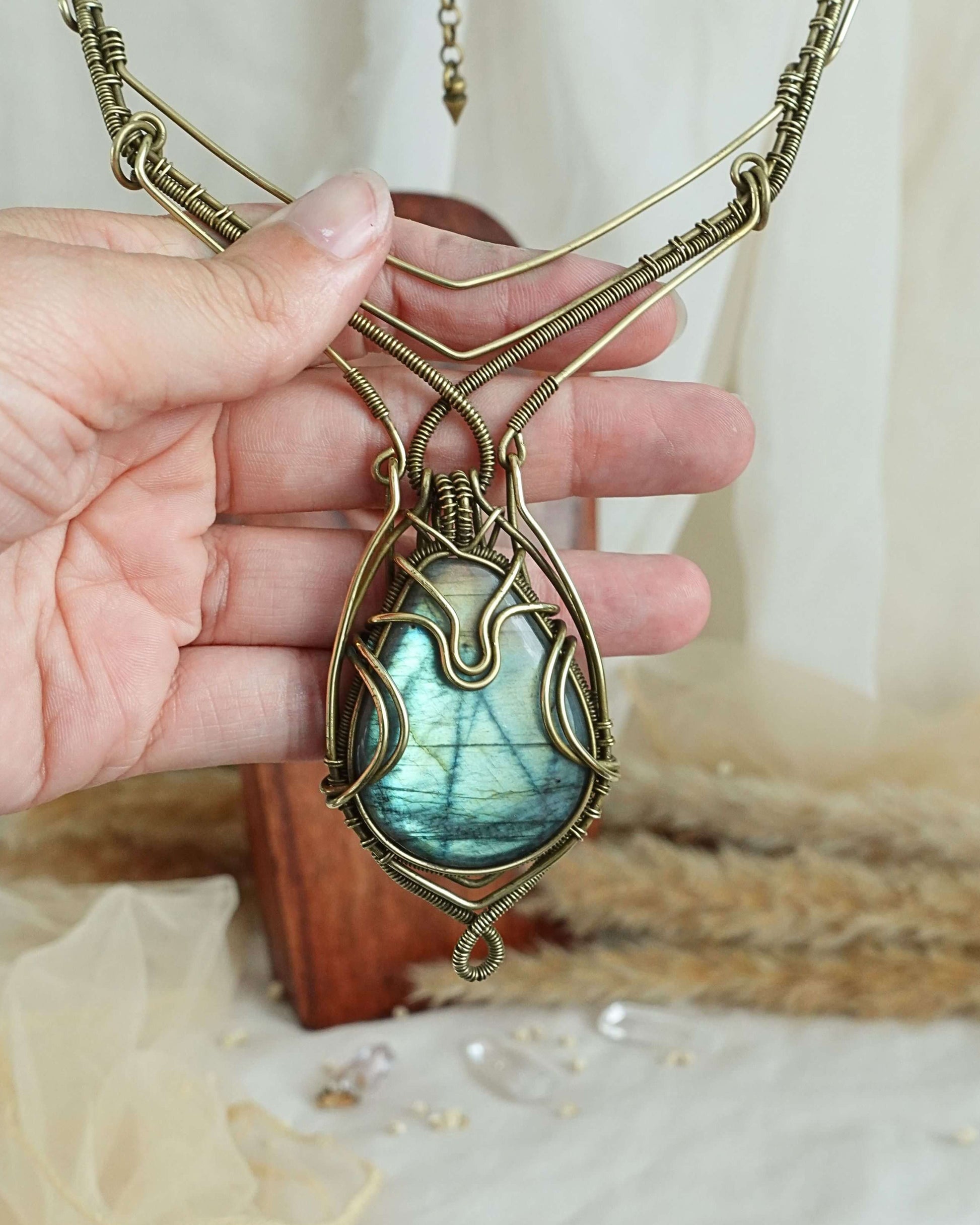 Detail of brass wirewrap surrounding a labradorite gemstone