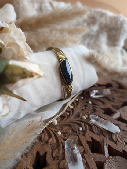 Handmade rainbow obsidian bracelet on brass wire — front view