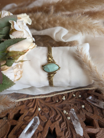 Side view of ZÏ chrysocolla bracelet in adjustable brass wire