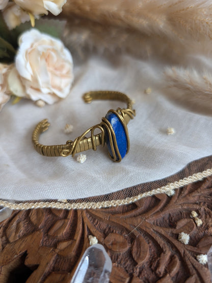 Detail of brass wirework holding the lapis lazuli stone